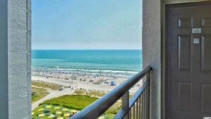 A balcony with a view of a beach and ocean. - Gorgeous Oceanfront Condo With Direct Ocean View (Myrtle Beach)