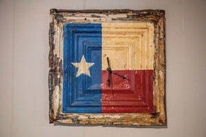 A wall-mounted clock with a rustic frame. - Clear River Cabin | Secluded 2BR w/ River Access (Bandera)