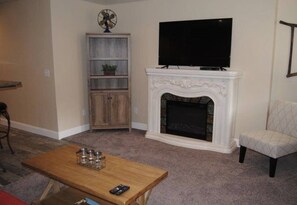 Smart TV, fireplace, DVD player, books