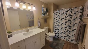 Combined shower/tub, towels, soap, toilet paper