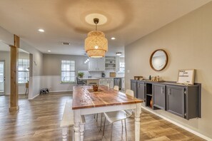 Enjoy meals in this inviting dining area with a large table and comfortable seating.