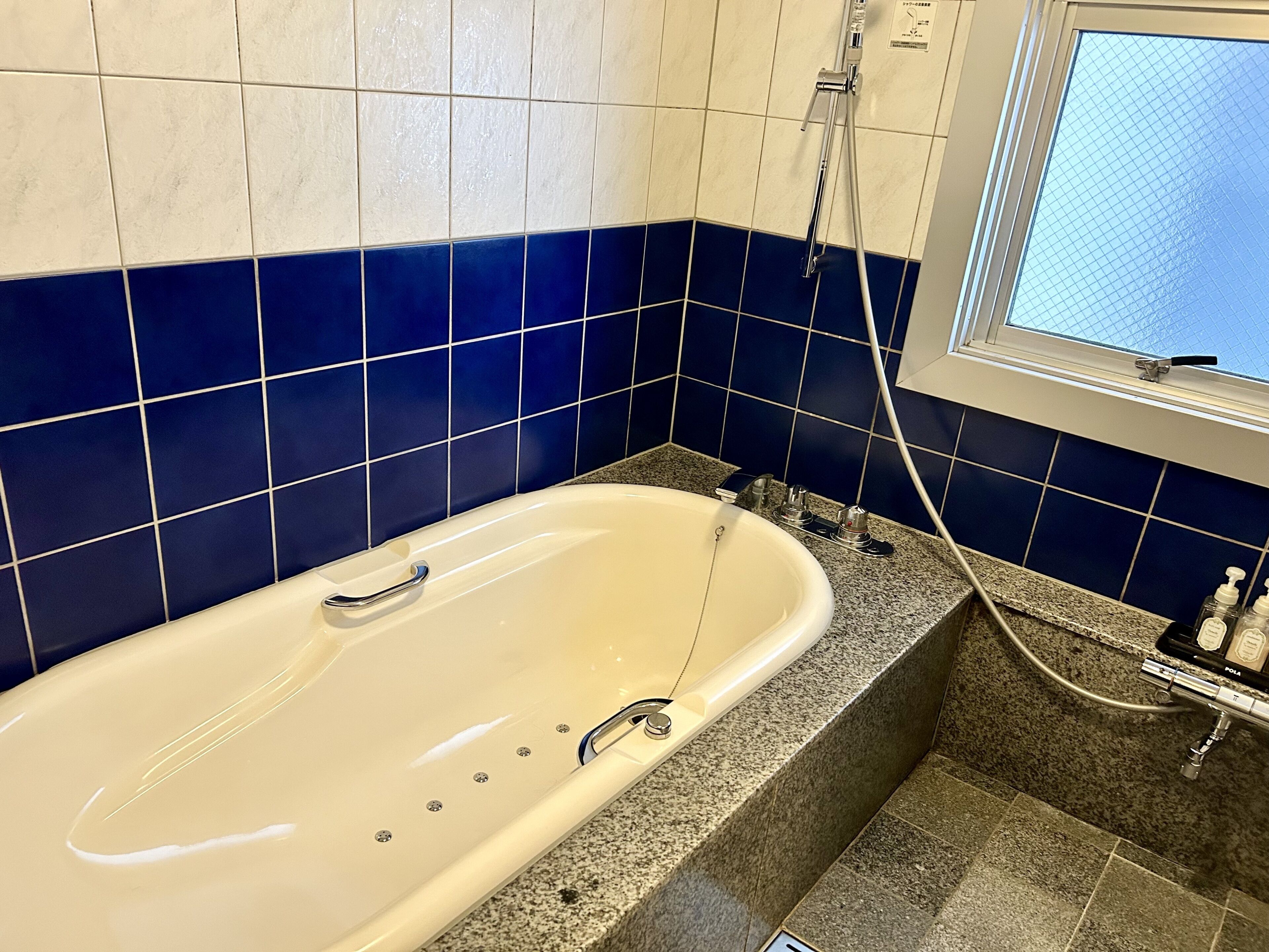 deluxe room, jetted tub | bathroom | free toiletries, hair dryer, slippers, electronic bidet