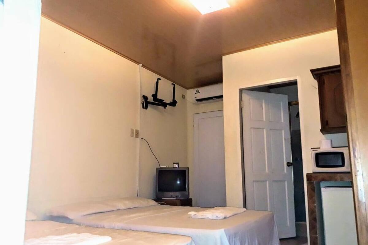 Habitación cuádruple familiar | Ropa de cama de alta calidad y decoración personalizada