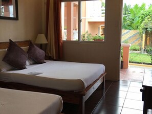 Deluxe Quadruple Room | Bed sheets - Amboy's Hometel (Basco)