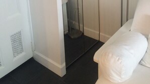 A modern bathroom with a walk-in shower, a white toilet, and a white sink. - Extend your rest in the Wellesley Square's best (Wellesley)