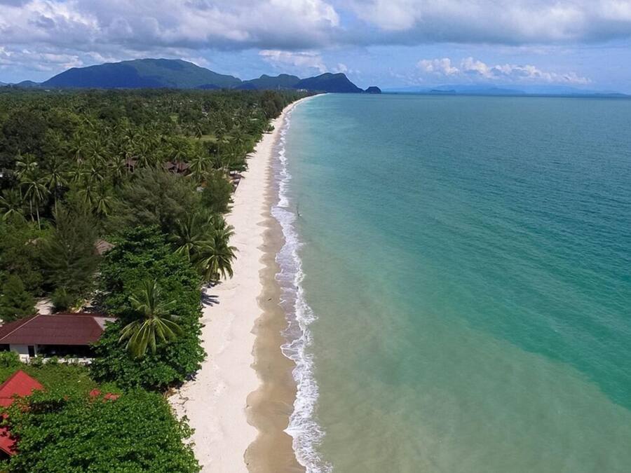 On the beach, white sand, beach towels, beach massages