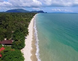 On the beach, white sand, beach towels, beach massages