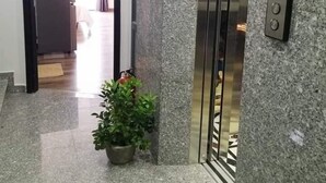 An elevator with a digital display showing the floor number 6. - Florence Apartment (Nha Trang)