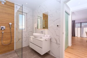 Shower, hair dryer, towels, soap