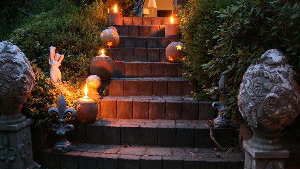 A staircase with decorative elements and candles.