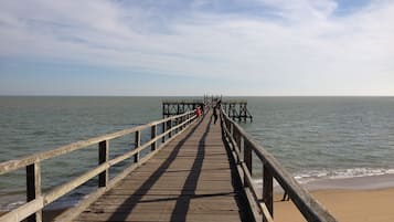 On the beach, sun-loungers