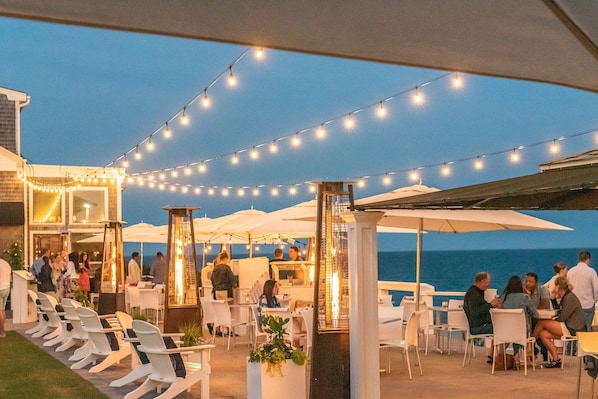 Enjoy al fresco dining with a view of the sea from our outdoor dining area.