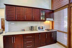 Kitchen area with ample storage and modern appliances.