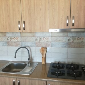 Fridge, cookware/dishes/utensils, dining tables