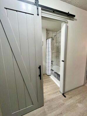 Combined shower/tub, hair dryer, towels, soap