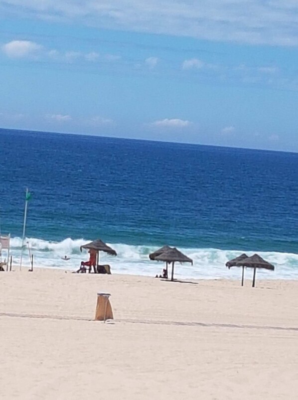 On the beach, sun-loungers