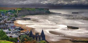 Stroll along the sandy beach and enjoy the serene coastal views.