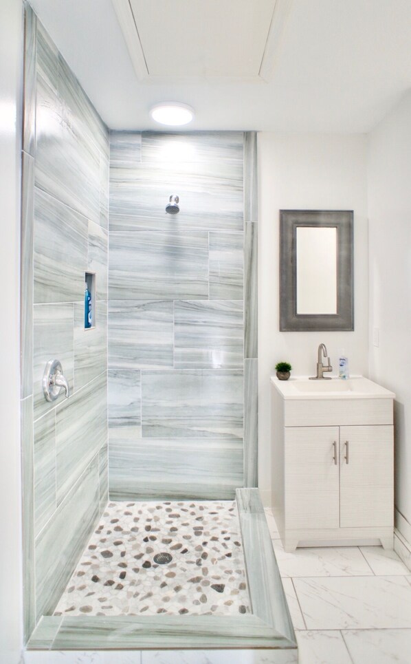 Shower, hair dryer, towels, soap
