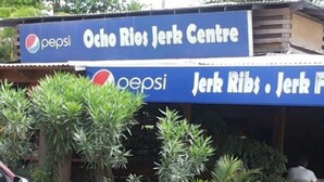 A building with a sign for 'Ocho Rios Jerk Centre' and 'Pepsi' branding. - Chill on tha hill/ free wi fi <br>A/c, free wi fi, gated community  (ocho rios)