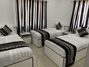 4 habitaciones, tabla de planchar con plancha, wifi y ropa de cama 