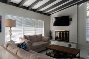 TV, fireplace, books, offices