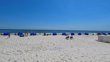 On the beach, sun loungers, beach towels