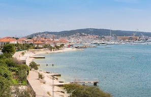 A coastal town with a marina, sandy beach, and residential buildings. - Gem of the Sea Alenka (Seget)