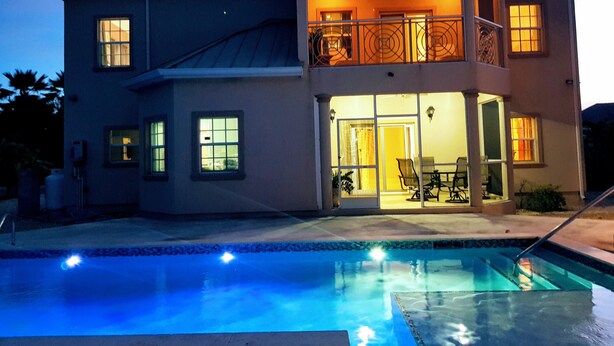 A two-story house with a swimming pool in the foreground. - Casa de Bells 2 - Studio apartment with pool, gazebo, private entrance & parking (George Town)