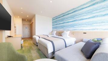 A hotel room with two beds, a green armchair, a flat-screen TV, and a large abstract painting on the wall.