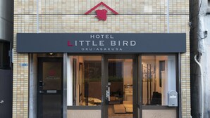 A hotel named "Hotel Little Bird" with a tiled facade, a visible entrance, and a small awning above the door. - Hotel Little Bird Oku-asakusa (Tokyo)