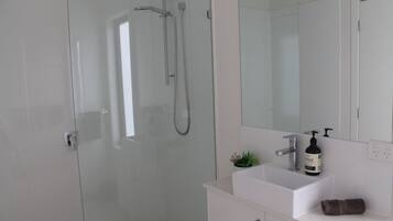 Combined shower/bathtub, hair dryer, bathrobes, towels