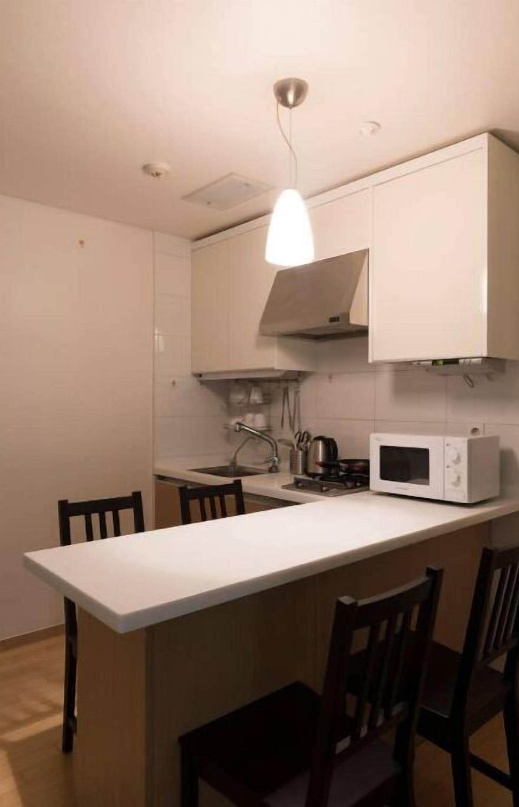 Fridge, microwave, cookware/dishes/utensils, spices