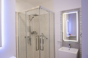 Shower, hair dryer, towels, soap