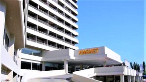 A multi-story parking structure with a prominent 'ANGKET' sign. - 1 bed at Angket Hip Residence (Pattaya)