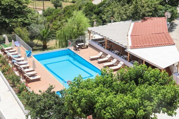 Seasonal outdoor pool, pool umbrellas, pool loungers