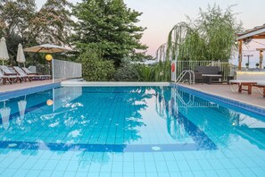 Seasonal outdoor pool, pool umbrellas, pool loungers