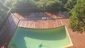 A wooden deck with a swimming pool. - Kangela 11 (Ponta d'Ouro)