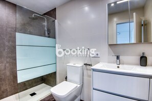 Shower, towels, soap, toilet paper