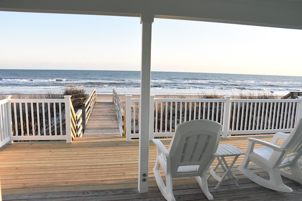 Covered deck overlooking beach and ocean with private beach access