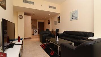 Apartment, 1 Bedroom | Living area | Flat-screen TV