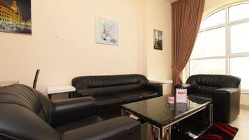 Apartment, 1 Bedroom | Living room | Flat-screen TV