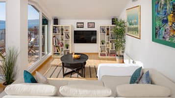 Apartment, 2 Bedrooms | Living area | 107-cm flat-screen TV with cable channels, TV