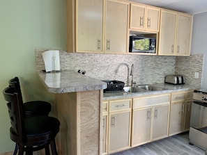 Fridge, microwave, stovetop, coffee/tea maker