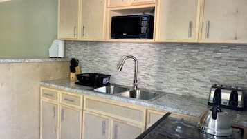 Fridge, microwave, stovetop, coffee/tea maker