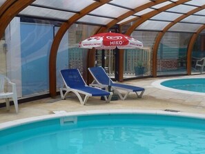 Indoor pool, seasonal outdoor pool, pool umbrellas, pool loungers