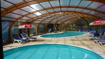 Indoor pool, seasonal outdoor pool, pool umbrellas, pool loungers