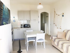 Apartment, 1 Bedroom, Pool Access, Sea View | Living room