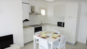 Apartment, 1 Bedroom, Pool Access, Sea View | Private kitchen | Microwave, coffee/tea maker, cookware/dishes/utensils