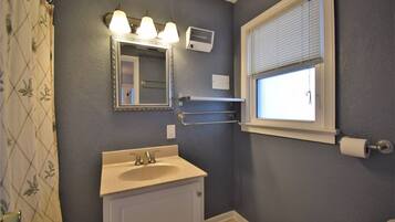 Combined shower/bathtub, soap, toilet paper