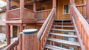 A wooden staircase leading to a porch with a railing. - Secluded, Spacious, Close to Town, Large Lot, Great Family Home, Hot Tub (Pagosa Springs)